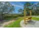 Wooden swing set with views of the marshland and surrounding landscaping at 4000 Saltwater Cir, Johns Island, SC 29455