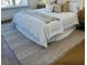 Cozy bedroom featuring a comfortable bed, a plush rug, and natural light from the window at 405 Oak Hammock Ct # 49, Johns Island, SC 29455