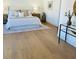 Serene bedroom with hardwood floors, a large bed, and tasteful decor creates a relaxing retreat at 405 Oak Hammock Ct # 49, Johns Island, SC 29455