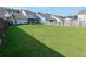 Spacious backyard with lush green grass and a privacy fence, perfect for outdoor activities at 408 Fox Sparrow Ct, Summerville, SC 29486