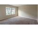 Empty carpeted bedroom with neutral paint and two windows with blinds offering natural light at 408 Fox Sparrow Ct, Summerville, SC 29486