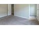 Empty bedroom featuring carpeted floors, neutral paint, a window, closet, and en-suite at 408 Fox Sparrow Ct, Summerville, SC 29486