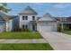 Charming two-story home with an attached two-car garage, well-manicured lawn, and beautiful curb appeal at 408 Fox Sparrow Ct, Summerville, SC 29486