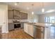 Modern kitchen with stainless steel appliances, granite countertops, and a kitchen island with a sink at 408 Fox Sparrow Ct, Summerville, SC 29486