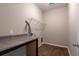 Well-lit laundry room with counter space and wire shelving at 408 Fox Sparrow Ct, Summerville, SC 29486