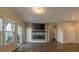 Open living room featuring a modern fireplace with sleek tv wall mount and sliding glass door to back patio at 408 Fox Sparrow Ct, Summerville, SC 29486