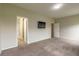 Spacious main bedroom featuring a flat screen tv and a door to the main bathroom at 408 Fox Sparrow Ct, Summerville, SC 29486