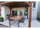 Outdoor patio featuring a wooden pergola and dining set, perfect for entertaining and relaxing at 408 Fox Sparrow Ct, Summerville, SC 29486