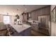 Modern kitchen featuring sleek gray cabinetry, stainless steel appliances, and a breakfast bar for casual dining at 409 Oak Hammock Ct # 50, Johns Island, SC 29455