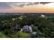 Breathtaking aerial view featuring a luxury home with pool nestled within a lush, green landscape at 4121 Golf Cottage Ln, Johns Island, SC 29455