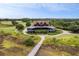 Beautiful aerial view of a home and golf course, surrounded by lush greenery and scenic landscaping at 4121 Golf Cottage Ln, Johns Island, SC 29455