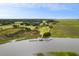 Breathtaking view of a waterfront community featuring a dock, boat, and surrounding marshland at 4121 Golf Cottage Ln, Johns Island, SC 29455