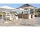 Outdoor bar and dining area with water views, perfect for entertaining at 4121 Golf Cottage Ln, Johns Island, SC 29455