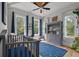 Charming Bedroom with ample natural light, hardwood floors, and cute decorations at 4121 Golf Cottage Ln, Johns Island, SC 29455