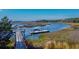 Picturesque waterfront scene featuring a private dock with boat and surrounding marshland landscape at 4121 Golf Cottage Ln, Johns Island, SC 29455