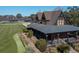 Stunning home featuring a long porch, lush landscaping, brick pathway, and golf course views at 4121 Golf Cottage Ln, Johns Island, SC 29455