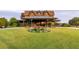 Beautiful home with an inviting portico and lush, manicured landscaping at 4121 Golf Cottage Ln, Johns Island, SC 29455