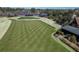 Scenic view of manicured golf course with well-maintained lawn, trees, and surrounding buildings at 4121 Golf Cottage Ln, Johns Island, SC 29455