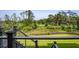 Breathtaking golf course view from a private balcony with wrought iron railings and lush greenery at 4121 Golf Cottage Ln, Johns Island, SC 29455