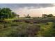 Picturesque view of a lush green golf course with marsh in the background at 4121 Golf Cottage Ln, Johns Island, SC 29455