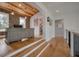 Hallway overlooking study with wood ceiling, hardwood floors, and natural light at 4121 Golf Cottage Ln, Johns Island, SC 29455