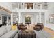 Spacious living room with soaring ceilings and decorative chandelier at 4121 Golf Cottage Ln, Johns Island, SC 29455