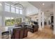 Spacious living room with hardwood floors, large windows, and vaulted ceiling at 4121 Golf Cottage Ln, Johns Island, SC 29455