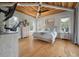 Spacious primary bedroom with wood ceiling, multiple windows, and luxury finishes at 4121 Golf Cottage Ln, Johns Island, SC 29455