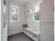 Mudroom with a built-in bench, storage cubbies, and plenty of natural light at 4121 Golf Cottage Ln, Johns Island, SC 29455