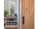 Walk-in pantry with custom shelving and a sliding barn door at 4121 Golf Cottage Ln, Johns Island, SC 29455