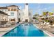 Stunning pool area, showcasing the poolside fireplace, bar, and beautiful design at 4121 Golf Cottage Ln, Johns Island, SC 29455