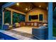 Poolside pavilion with brick accents, ceiling fan, TV, bar area, and outdoor seating with a view of the pool at 4121 Golf Cottage Ln, Johns Island, SC 29455