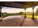 View of the landscaped grounds from the home's portico, capturing a serene and inviting atmosphere at 4121 Golf Cottage Ln, Johns Island, SC 29455