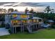 Gorgeous home featuring a backyard oasis with a sparkling pool and covered outdoor living area at 4121 Golf Cottage Ln, Johns Island, SC 29455