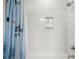 Shower with white subway tiles and a shower curtain with sharks on it at 4121 Golf Cottage Ln, Johns Island, SC 29455