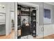 Climate-controlled wine cellar with custom shelving and marble floors at 4121 Golf Cottage Ln, Johns Island, SC 29455