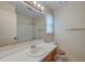 Bathroom with a sink, large mirror, vanity and wooden cabinets at 441 Compton Dr, Moncks Corner, SC 29461