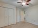 Neutral bedroom featuring a ceiling fan, closet, and entry to an adjoining room at 441 Compton Dr, Moncks Corner, SC 29461