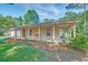 Charming home featuring a covered porch with a swing and an attached garage at 441 Compton Dr, Moncks Corner, SC 29461