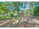 A charming home nestled among mature trees with a well-maintained lawn at 441 Compton Dr, Moncks Corner, SC 29461