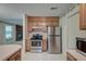 Functional kitchen with stainless steel appliances, light wood cabinets, and views into the carpeted living area at 441 Compton Dr, Moncks Corner, SC 29461