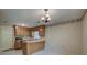 Practical kitchen featuring wood cabinets, a breakfast bar, and a view to the dining area at 441 Compton Dr, Moncks Corner, SC 29461