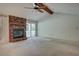 Spacious living room featuring a brick fireplace, vaulted ceiling with exposed beams, and a sliding glass door at 441 Compton Dr, Moncks Corner, SC 29461