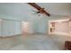 Spacious living room featuring a ceiling fan, neutral carpet, and access to other rooms at 441 Compton Dr, Moncks Corner, SC 29461