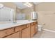 Bathroom with double sink vanity, ample storage, and neutral color palette at 528 Sea Foam St, Summerville, SC 29486