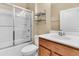 Modern bathroom with a shower-tub combination, sleek vanity, and storage shelves at 528 Sea Foam St, Summerville, SC 29486