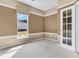 Neutral colored bedroom with natural light and a glass paned french door at 528 Sea Foam St, Summerville, SC 29486