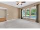 Bright bedroom featuring carpeted floors, ample natural light, and ceiling fan at 528 Sea Foam St, Summerville, SC 29486