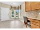 Bright breakfast nook with granite desk, natural light, tile floors and access to the exterior at 528 Sea Foam St, Summerville, SC 29486