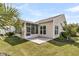 Beautiful home exterior with a screened in porch, manicured lawn, and tropical landscaping at 528 Sea Foam St, Summerville, SC 29486